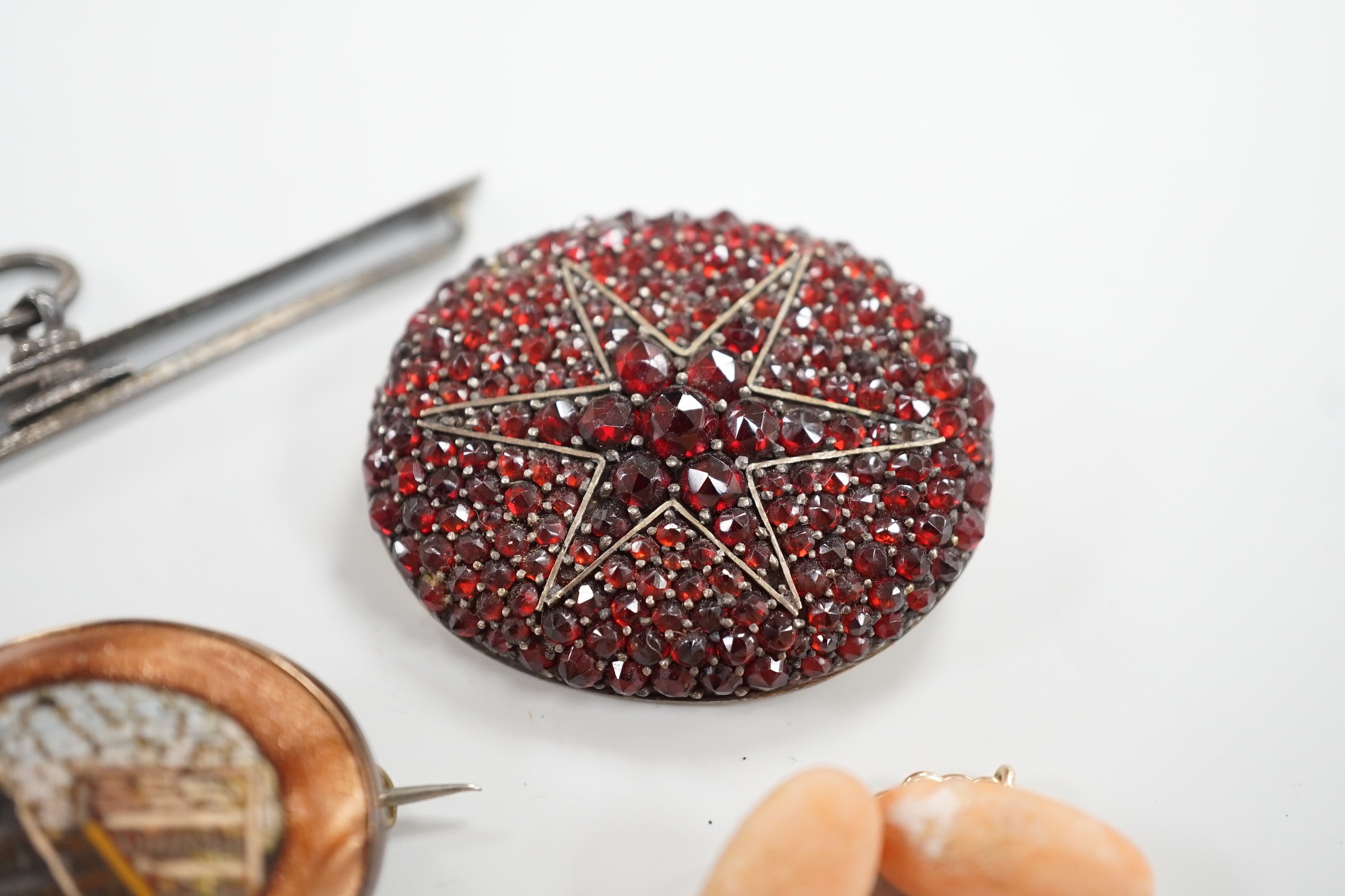 A pair of yellow metal and coral set cufflinks, coral 16mm and three assorted brooches including micro mosaic.